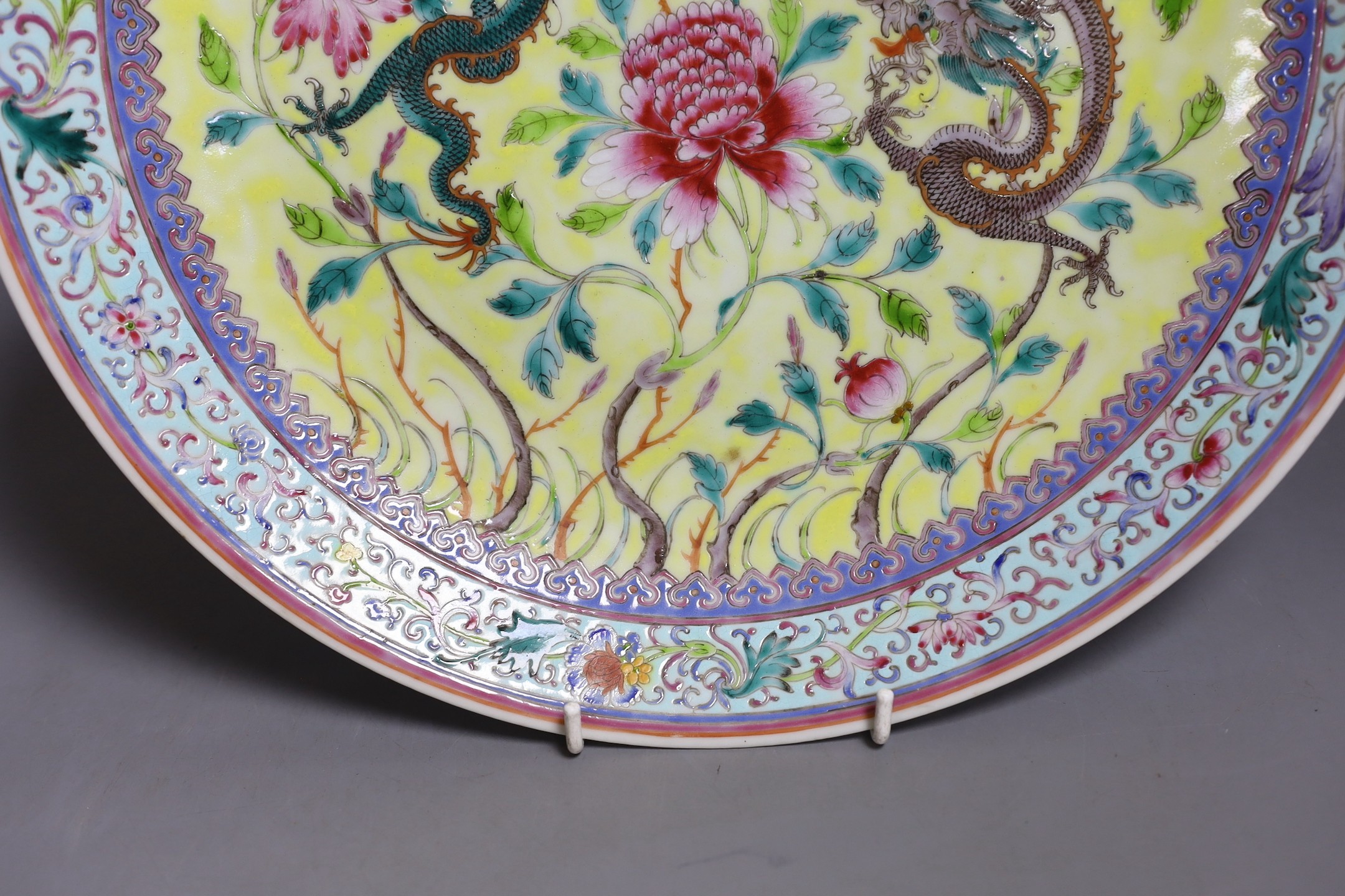 A Chinese yellow ground ‘dragon’ dish, Qianlong mark but Republic period, 34 cms diameter.
